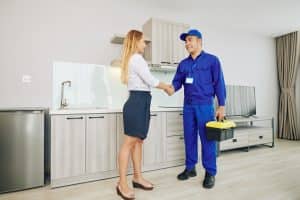 female-customer-greeting-electrician.jpg